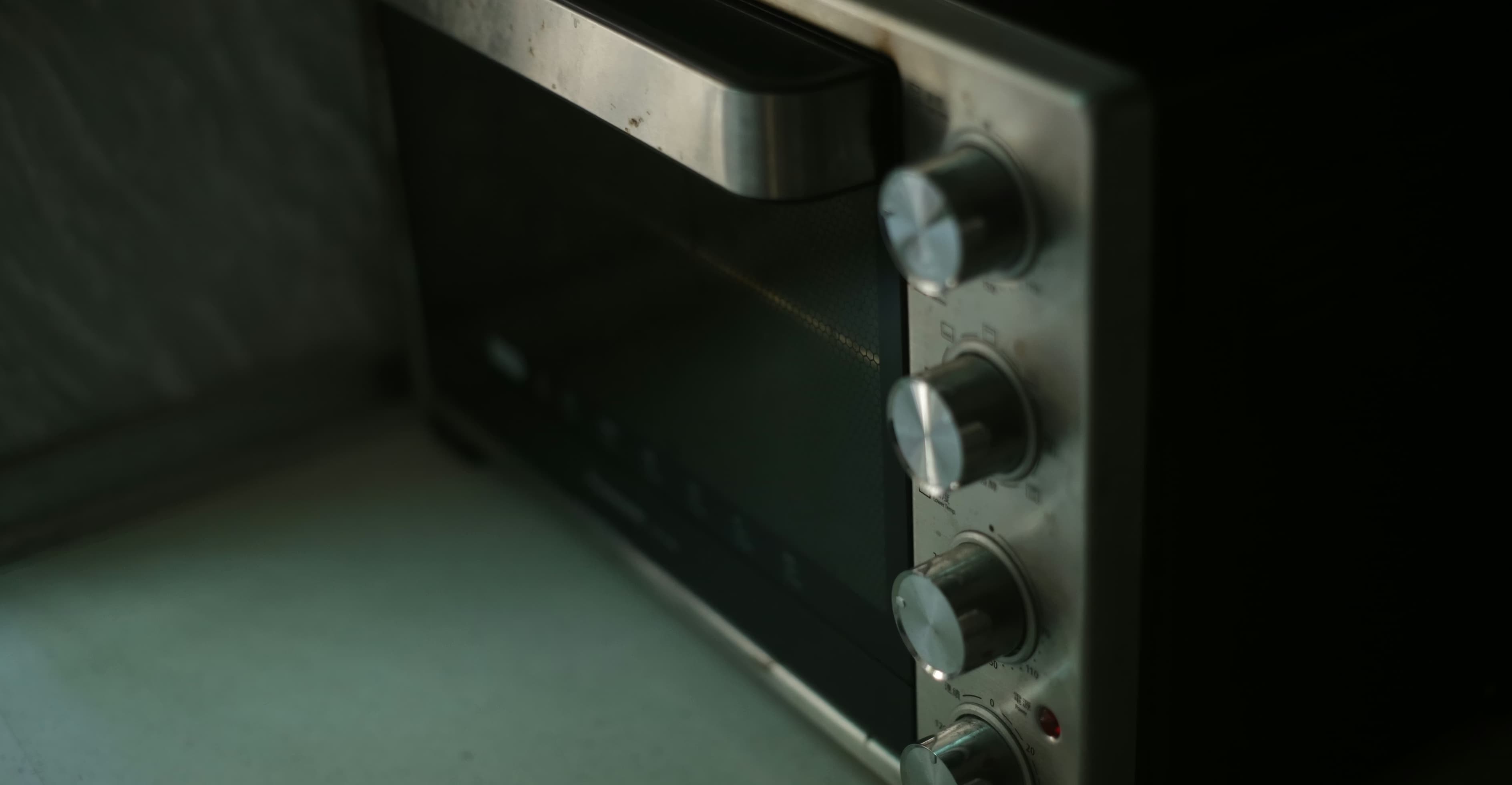 Professional technician repairing a microwave oven